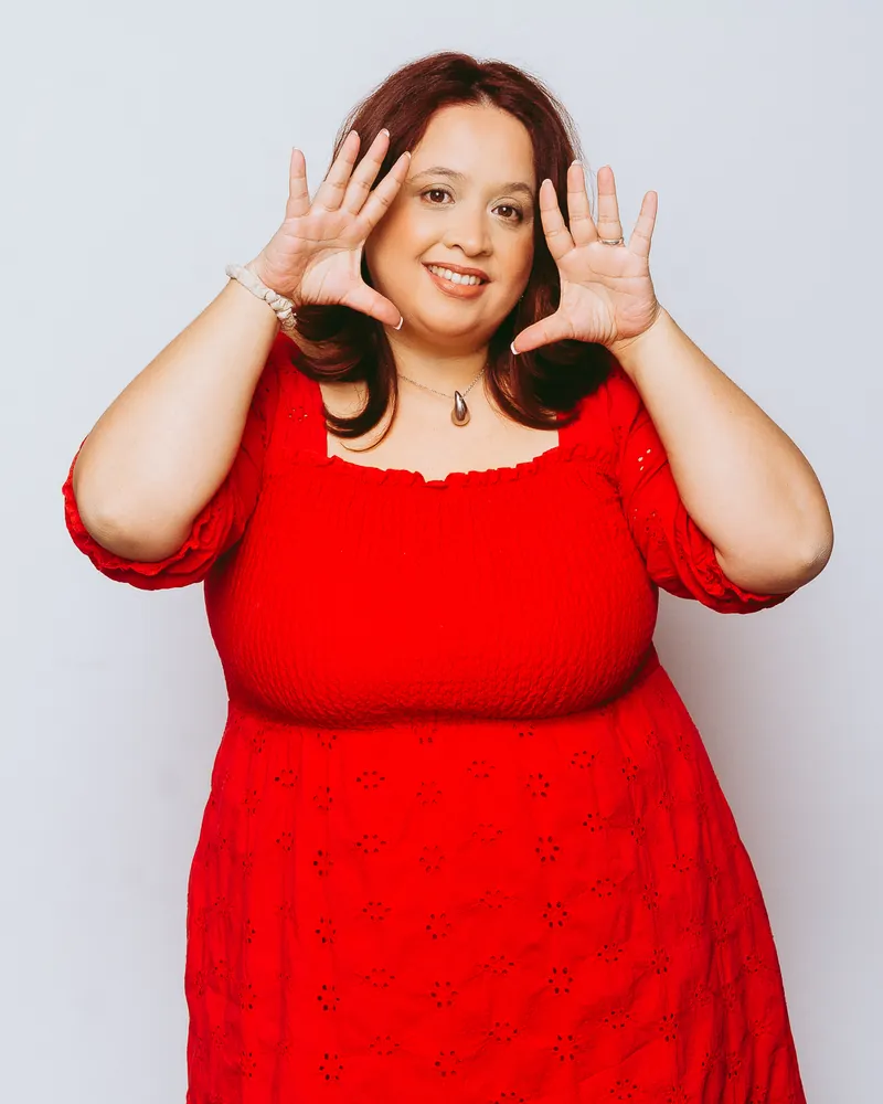 Natti McLean framing her face with her hands, representing a digital presence audit